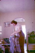 Family Julia (Judy) Kish Dorrough ironing; Our House;